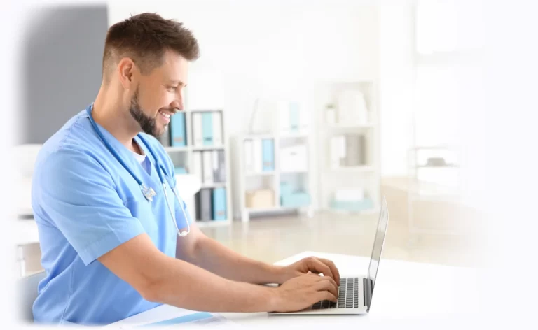male nurse desk laptop